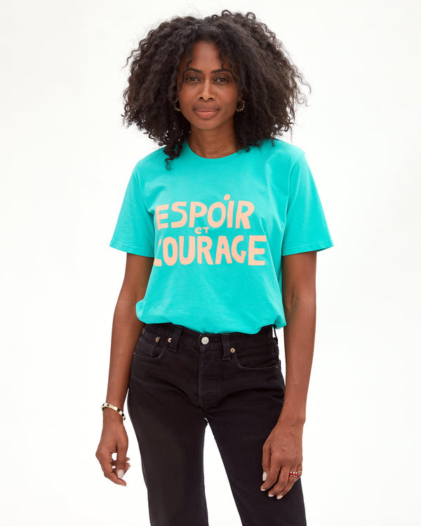 Mecca wearing the Desert Turquoise Espoir et Courage Original Tee with black jeans