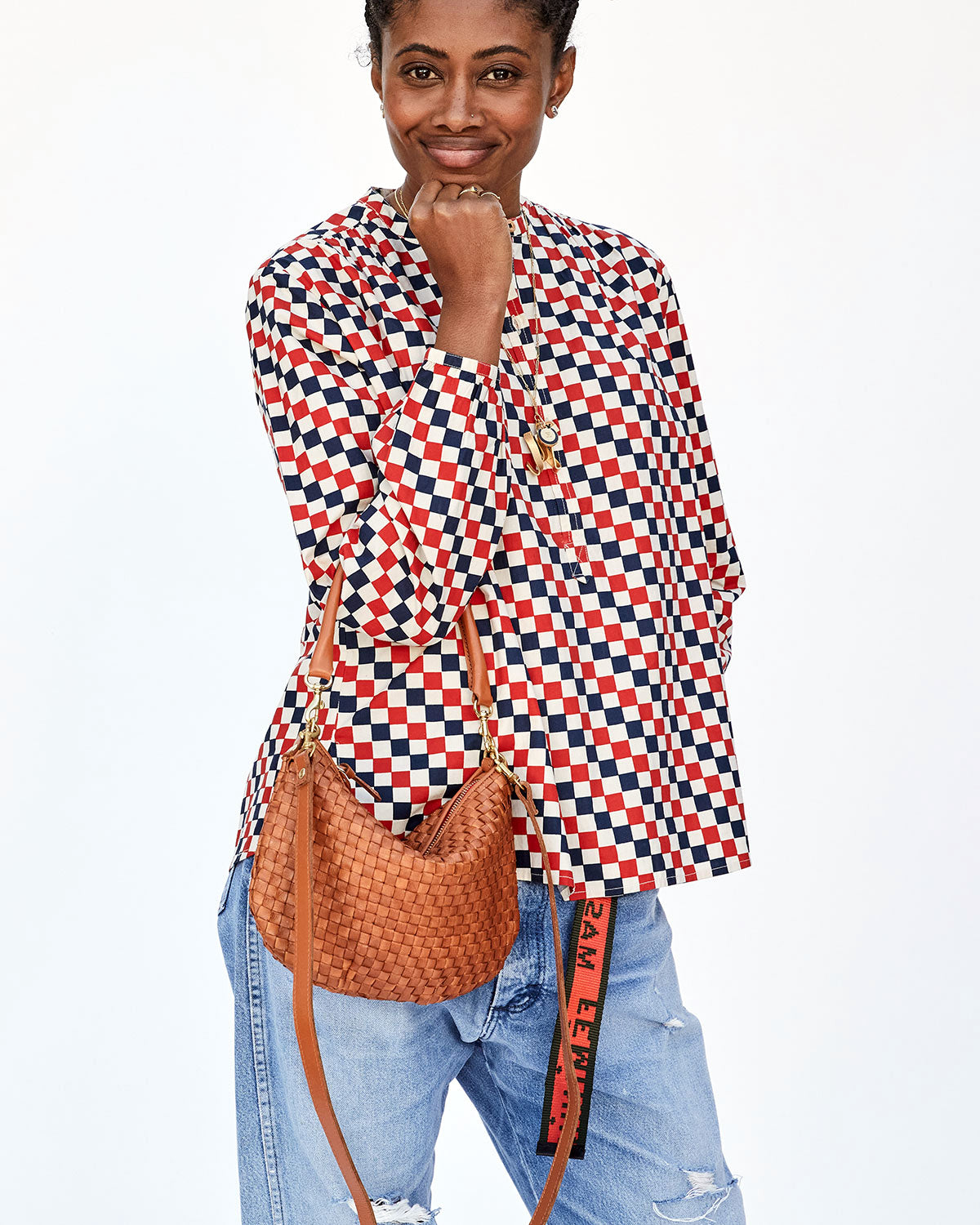 Mecca with her Head resting on her Chin Showing off the Natural Woven Checker Petit Moyen