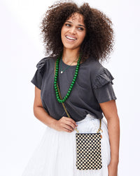 Mercedes Smiling and Wearing the Poche in Black & Cream Woven Checker