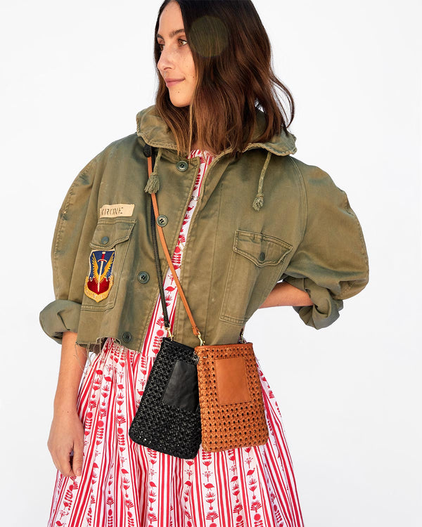 Frannie Wearing both the Black Rattan Poche and the Tan Rattan Poche Over her Army Surplus Jacket