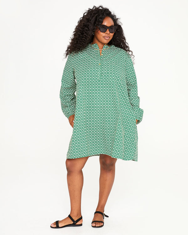 Candice wearing the Evergreen and Cream Rattan Print St. Martin Dress with her hands in the pockets