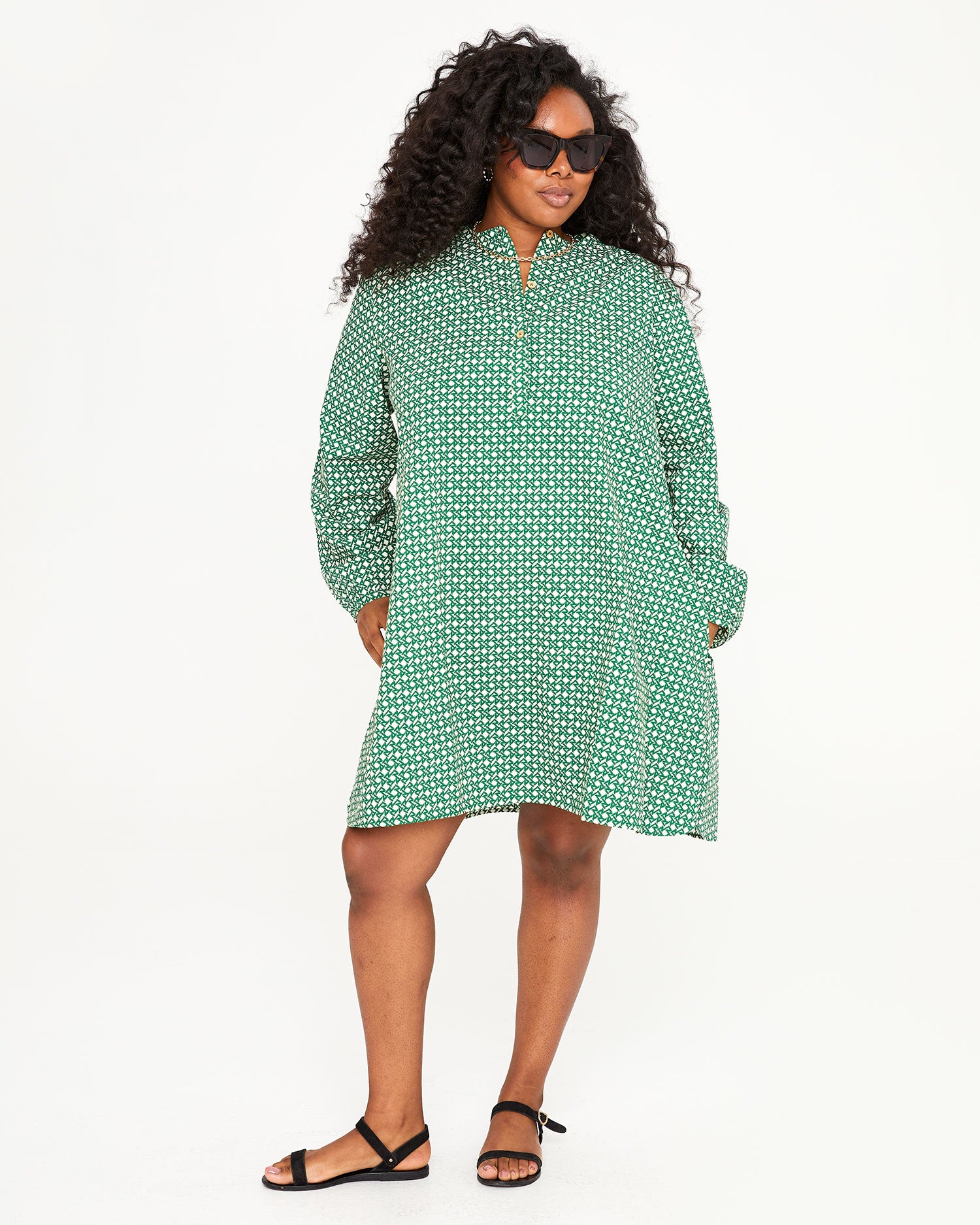 Candice wearing the Evergreen and Cream Rattan Print St. Martin Dress with her hands in the pockets
