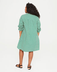 back view of Candice in the Evergreen and Cream Rattan Print St. Martin Dress