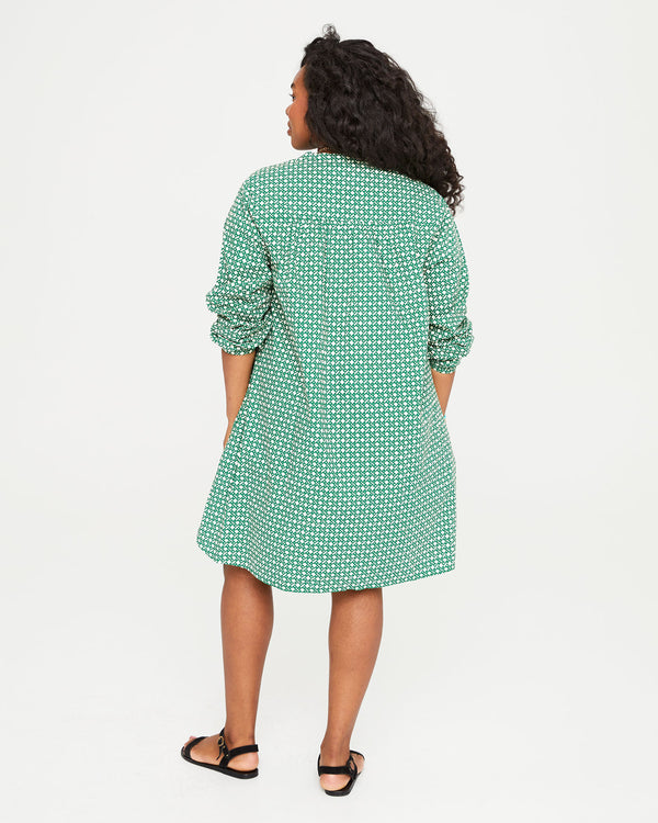 back view of Candice in the Evergreen and Cream Rattan Print St. Martin Dress