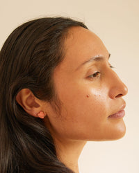 Andrea wearing the Stone Heart Stud Earrings
