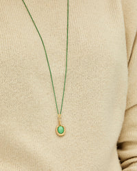 Close Up of Mecca Wearing the Jade Stone Horseshoe Charm  on the Green Coated Chain Necklace