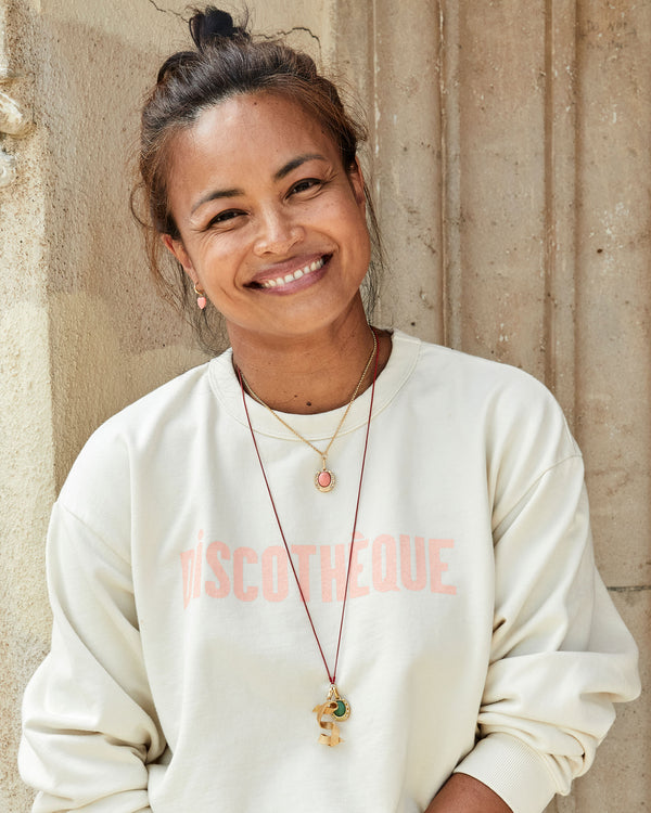 Joanna Wearing the Coral Stone Horseshoe Charm on the Rolo Chain Necklace