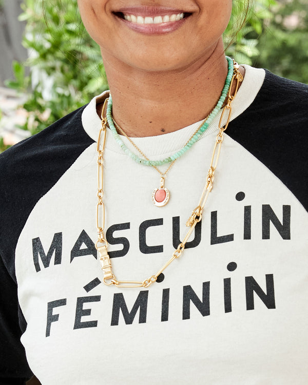 Joanna, in the Masculin Feminin Baseball Tee, Wearing the Coral Stone Horseshoe Charm on the Rolo Chain Necklace