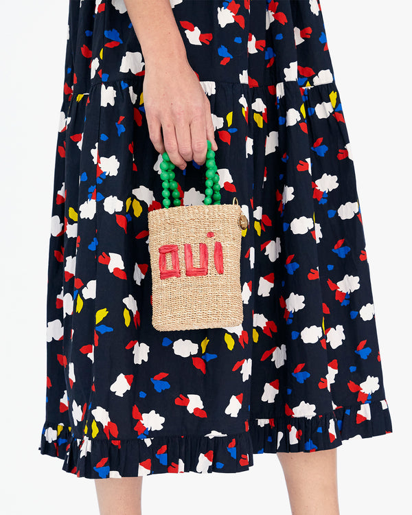 Danica Holding the Natural Oui Totita by its Top Handle