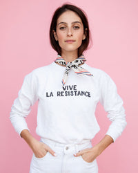 Frannie wearing the White Vive La Resistance Swetashirt