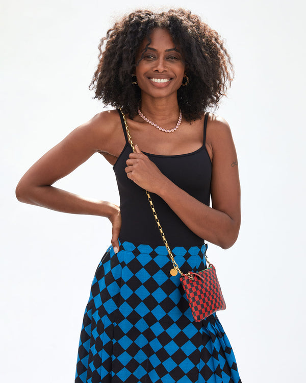 Mecca wearing the Rose Water Opal 16 Inch Stone Tennis Necklace with a skirt and tank top 