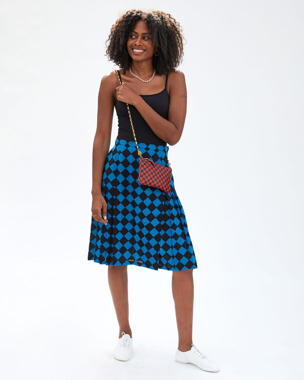mecca carrying the Red and Navy Checker Wallet Clutch w/ Tabs  with the box chain crossbody strap